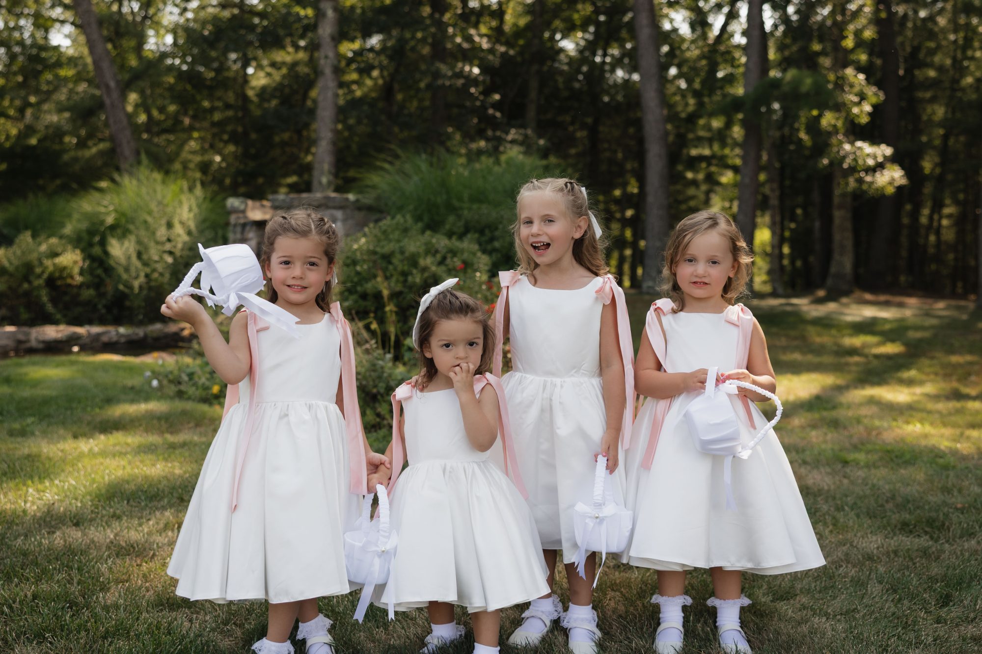 Four flower girls in white