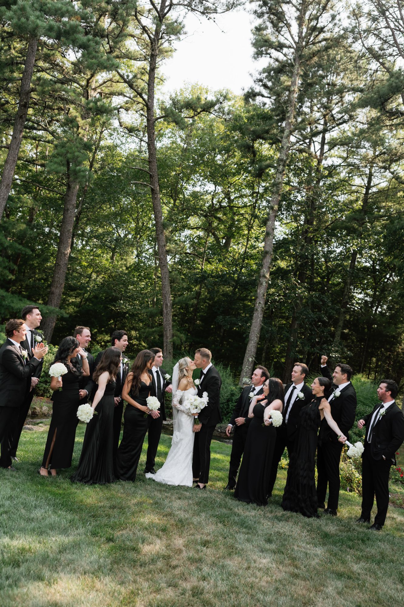 A wedding party gathered on the lawn at The Preserve